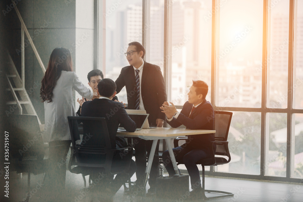 People Business Congratulation. Business people shaking hands, finishing up a meeting