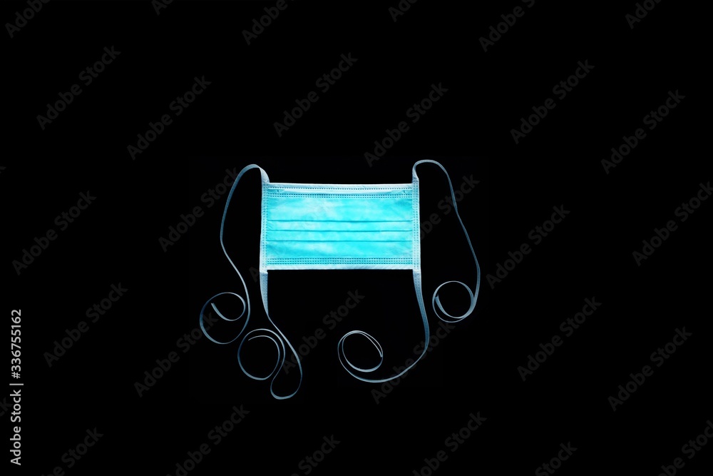 surgical mask with tie-on on black ground surgical mask with tie-on on black ground