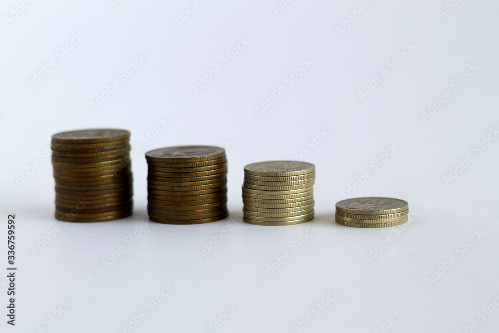 four stacks of coins on white background. copy space. finance. payment of bills four stacks of coins on white background. copy space. finance. payment of bills