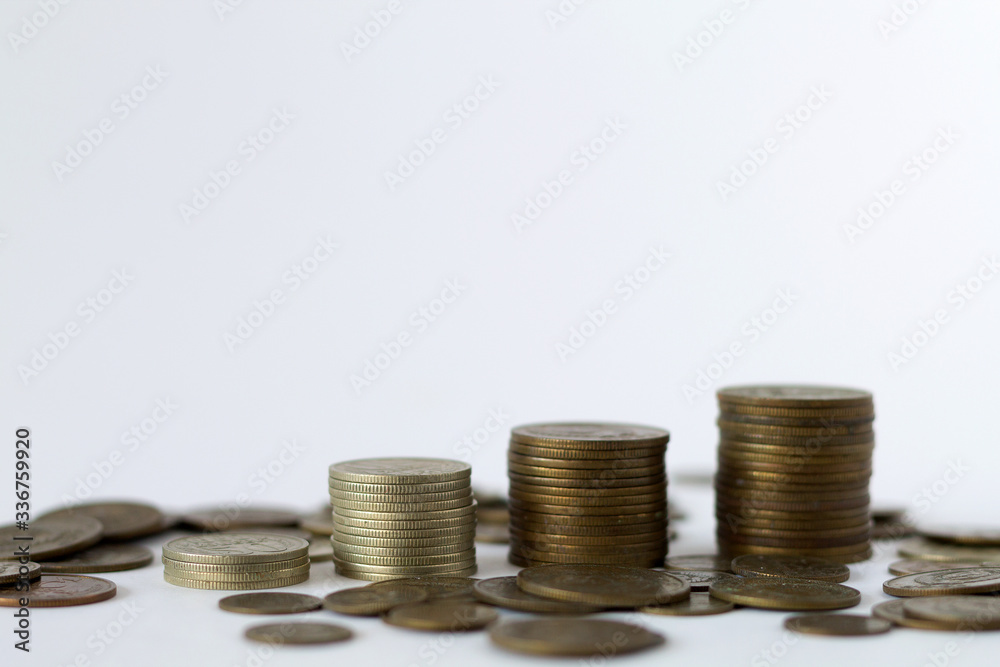 stack of coins on the white table. copy space. finance. payment of bills stack of coins on the white table. copy space. finance. payment of bills