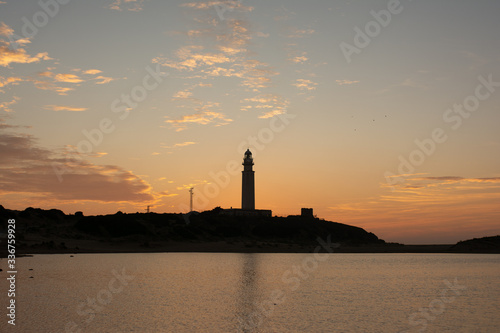 Amazing landscape of lighthouse trafalgar in cadiz at sunset nigth with light