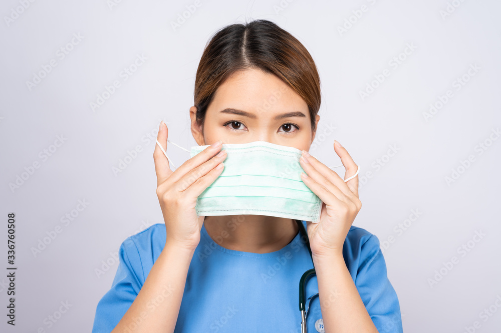 Portrait of young asian nurse wearing surgical mask Portrait of young asian nurse wearing surgical mask