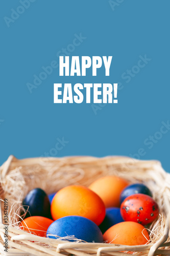 Easter eggs in trendy colors in the basket. The concept of stylish natural decoration for Easter, minimalistic, zero waste, greeting cards, etc.