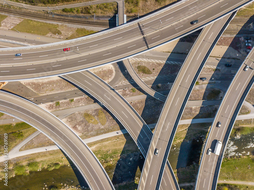 Aerial view of highway intersection with overpass in Switzerland. Large motorway bridge for car traffic.