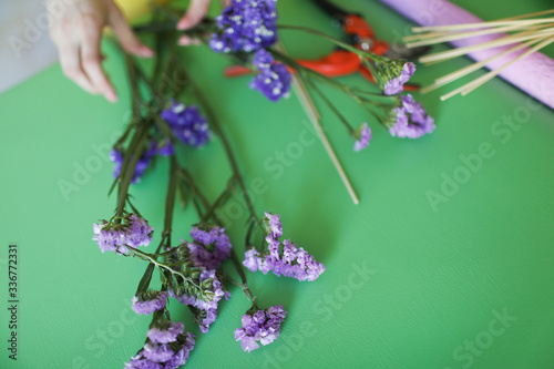 The process of preparing a handmade fruit bouquet.