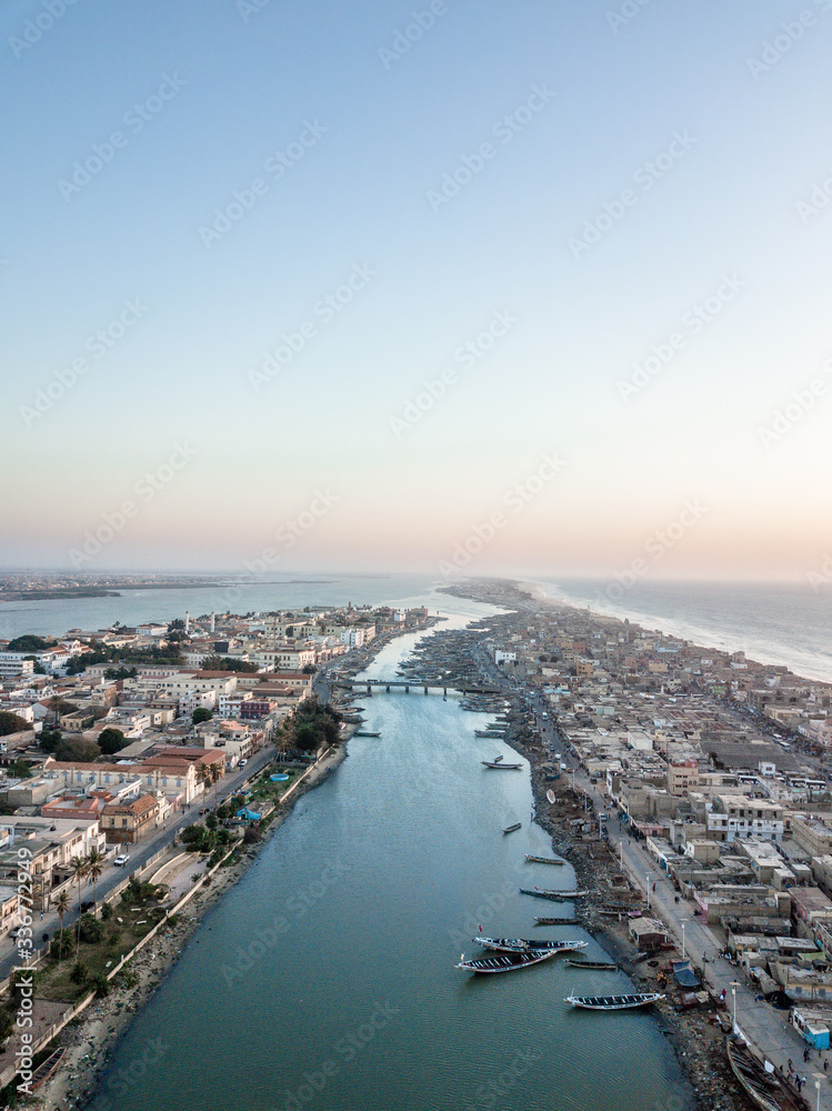 Aerial view of Saint-Louis coast of Senegal,  colonial architecture, African Venice by drone 