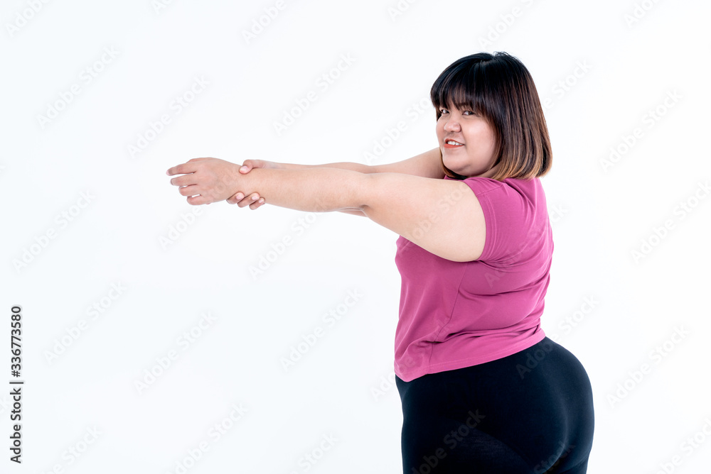 Asian fat woman Stretching arms to relax muscles after exercise To lose weight On white background, concept to People and health care with exercise Asian fat woman Stretching arms to relax muscles after exercise To lose weight On white background, concept to People and health care with exercise