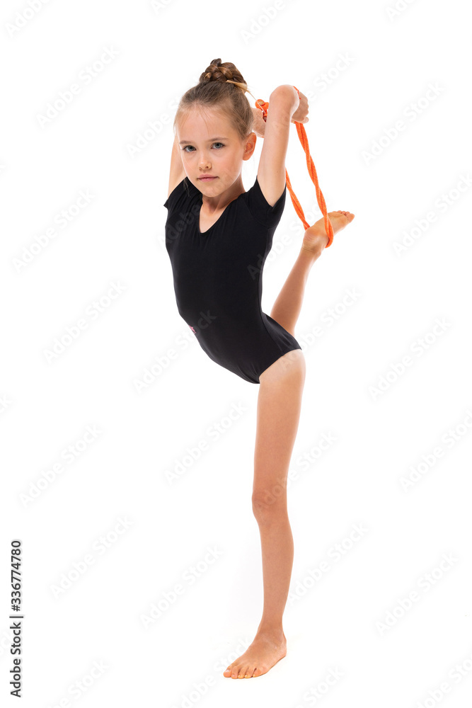 girl doing gymnastics in a sports swimsuit on a white background with copy space girl doing gymnastics in a sports swimsuit on a white background with copy space