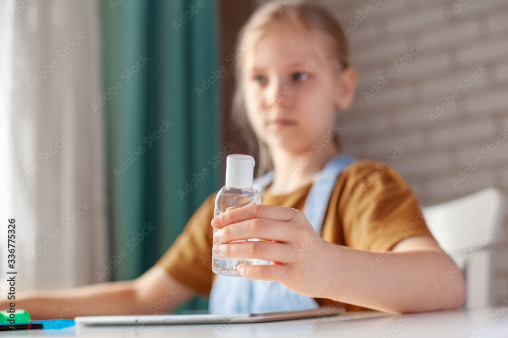 The girl is holding an antiseptic gel. Prevention, disinfection of hands, prevention of infection. The concept of a healthy lifestyle The girl is holding an antiseptic gel. Prevention, disinfection of hands, prevention of infection. The concept of a healthy lifestyle