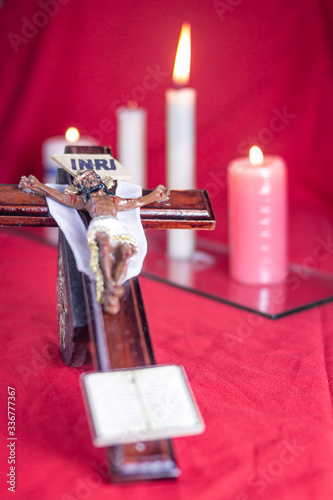christ jesus holy week with candles behind and red tablecloth 3