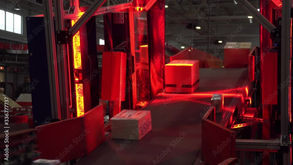 Barcode scanner on the Postal Parcel Sorting Line, Parcel Scanner Station In Distribution Center, Postal Parcel Sorting Line, Postal Conveyor System, Parcels are Moving on Belt Conveyor at Post Sortin