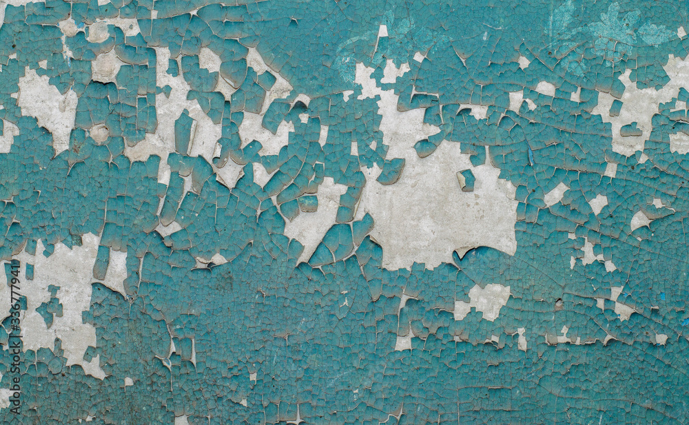 Obraz premium Old painted wall with cracked paint