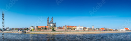 Panoramic view over downtown of Magdeburg, old town, Elbe river and Magnificent Cathedral at early Spring, Germany, at sunny day and blue sky, wide angle