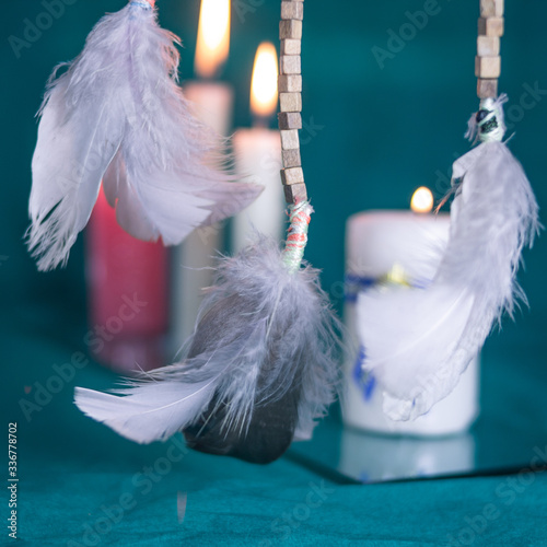 DREAM CATCHER FEATHERS WITH CANDLES AND GREEN TABLECLOTH 1