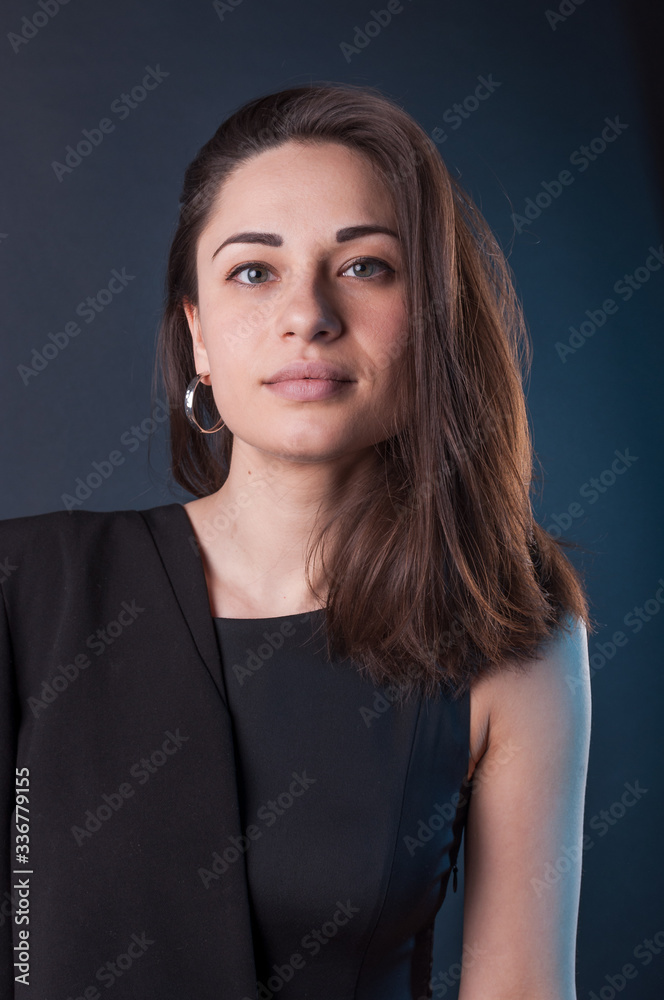 Attractive serious young lady in the darkness. Elegant black dress, so dark everywhere. Amazing girl with attractive appearance Attractive serious young lady in the darkness. Elegant black dress, so dark everywhere. Amazing girl with attractive appearance