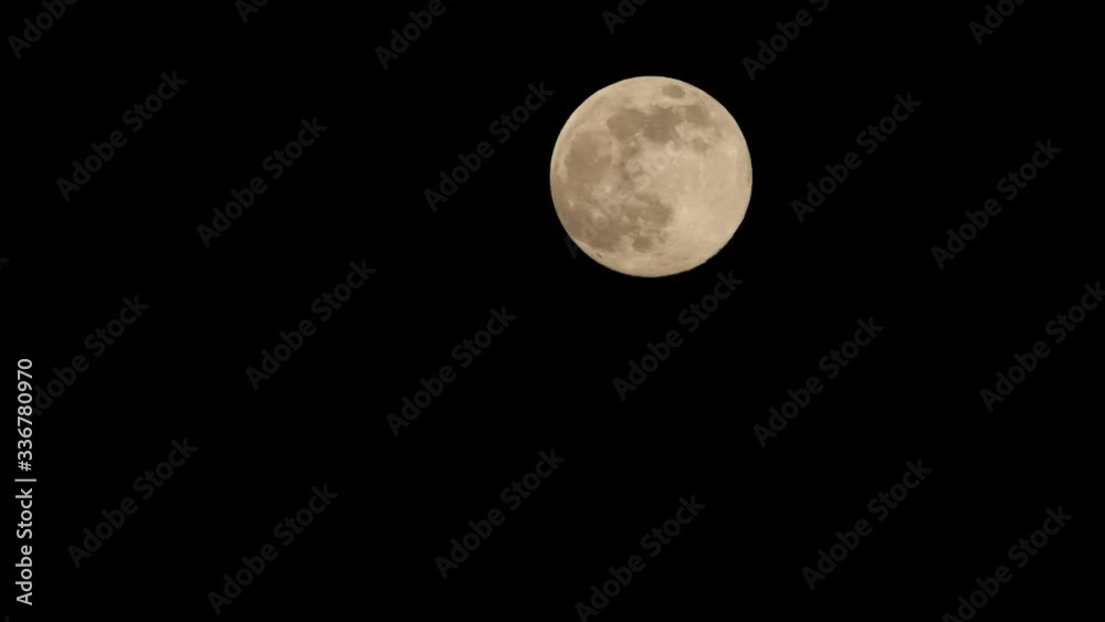 Full moon that moves on long focus at night Full moon that moves on long focus at night