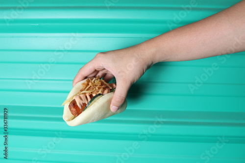 Customer hand with bao bun