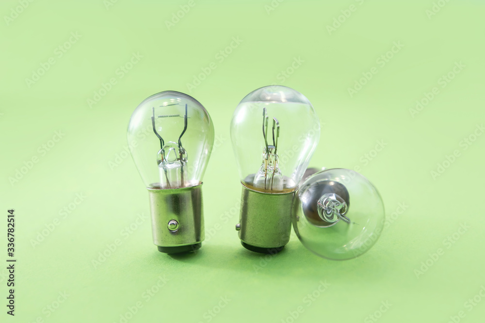 Electric light bulb on color background. Eauipment for car headlight 写真 | Adobe Stock