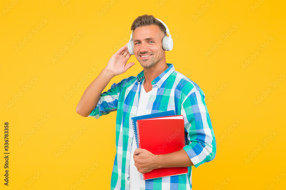 Online courses for remote learning during quarantine. Best online learning platforms to explore. Man listening online lecture. Adult student listen music. Guy wear headphones. Infinity learning Online courses for remote learning during quarantine. Best online learning platforms to explore. Man listening online lecture. Adult student listen music. Guy wear headphones. Infinity learning
