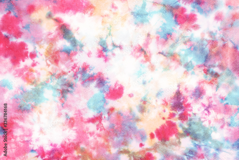 tie dye pattern hand dyed on cotton fabric abstract texture background. tie dye pattern hand dyed on cotton fabric abstract texture background.