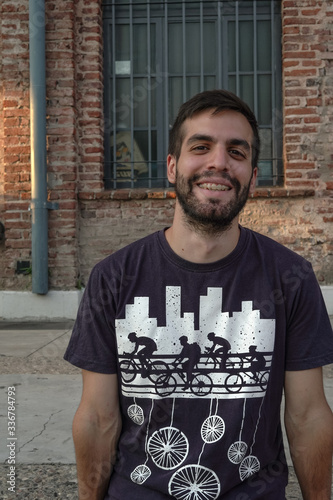 Young man smiling on the street photo