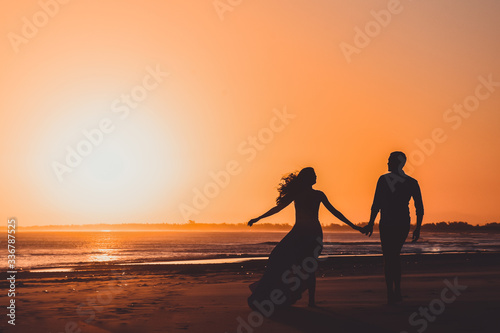 silhouette of a couple on the beach