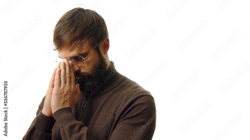 Pensive bearded businessman in eye glasses looking on the camera isolated on white background Pensive bearded businessman in eye glasses looking on the camera isolated on white background