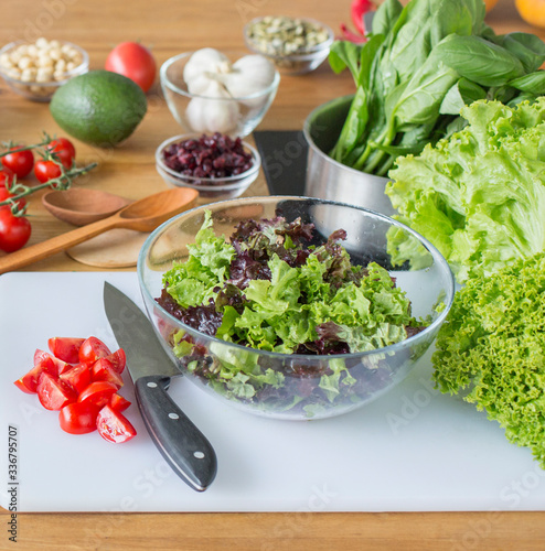 Healthy salad of greens in the kitchen, diet nutrition