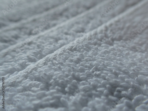 Close up macro photo with great detail of luxurious garment of 5 star hotel white cotton towel