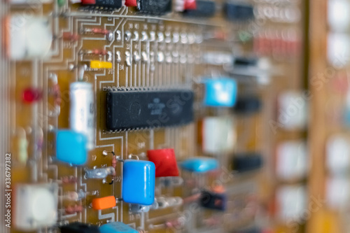 Electric control panel. Circuit boards with microchips and resistors. Close-up.