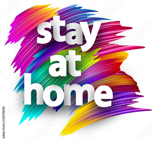 Stay at home sign over brush strokes background.