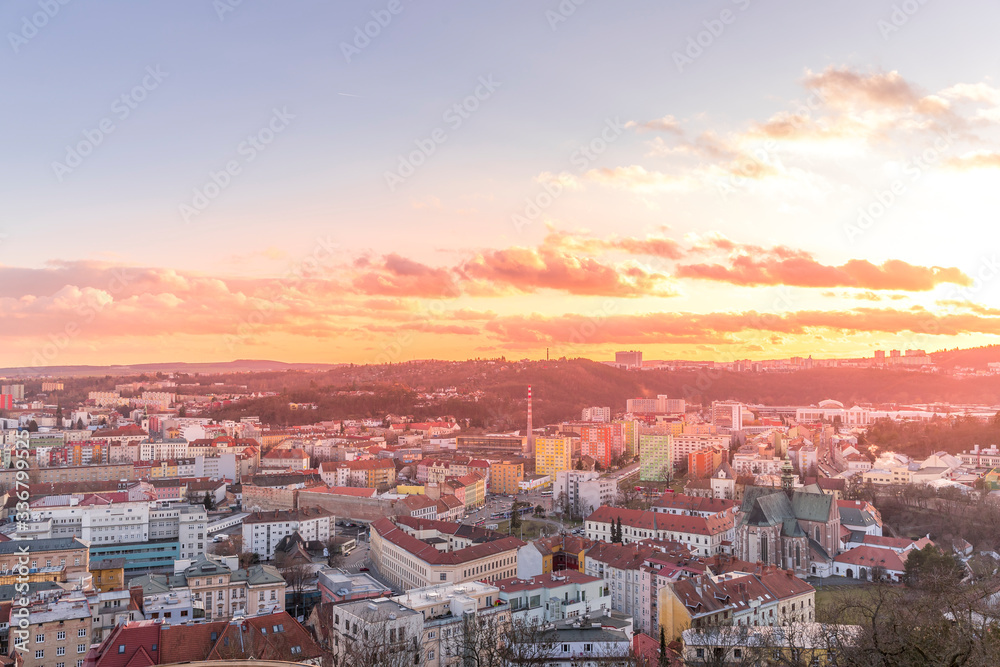 Day to night time-lapse when Brno city square and surroved area goes from sunset when sunshine change city colors to orange through sunset to night when city light goes on captured 4k high resolution