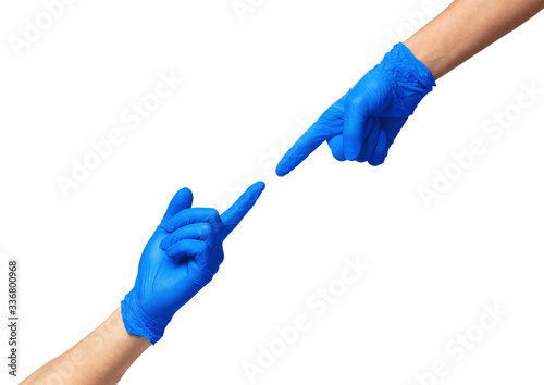 Male and female hands in medical gloves stretch to each other. Help concept. Close up