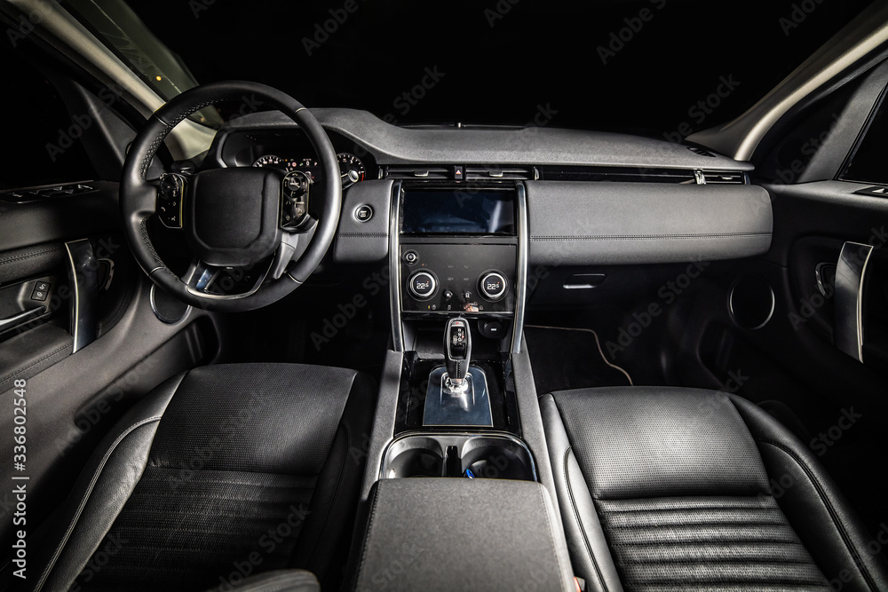 Dark luxury car Interior. Front seats of premium suv Leather panels. the view from the ceiling