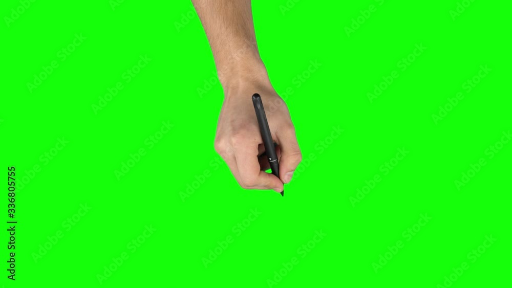 Male hand with liner pen is writing on green screen background. Close up Male hand with liner pen is writing on green screen background. Close up