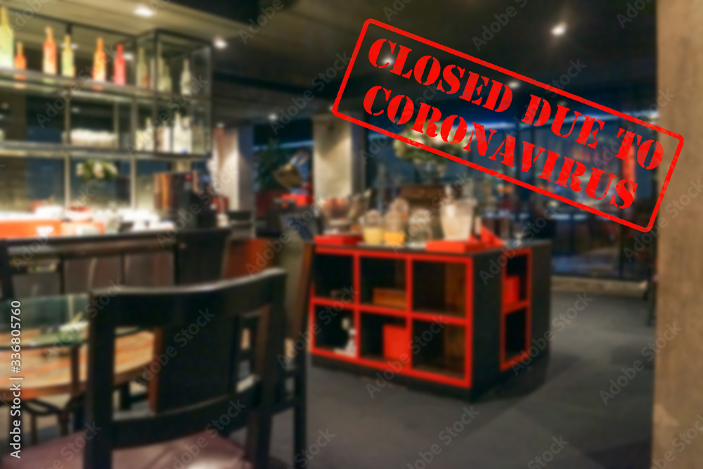 Defocused view of interior of an upmarket restaurant, empty and closed due to coronavirus or covid 19