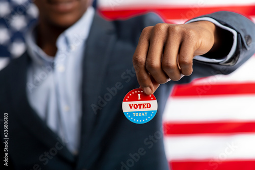 Unrecognizable african citizen of America holds I voted today photo