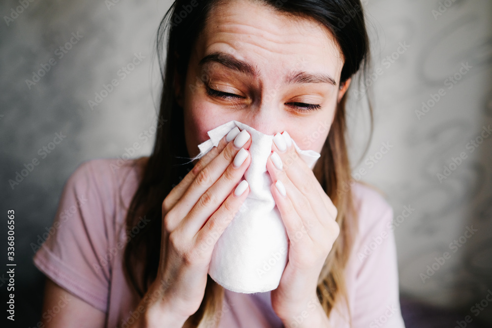 Cough in tissue covering nose and mouth when coughing as COVID-19 Cough in tissue covering nose and mouth when coughing as COVID-19