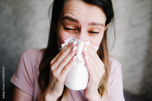 Cough in tissue covering nose and mouth when coughing as COVID-19