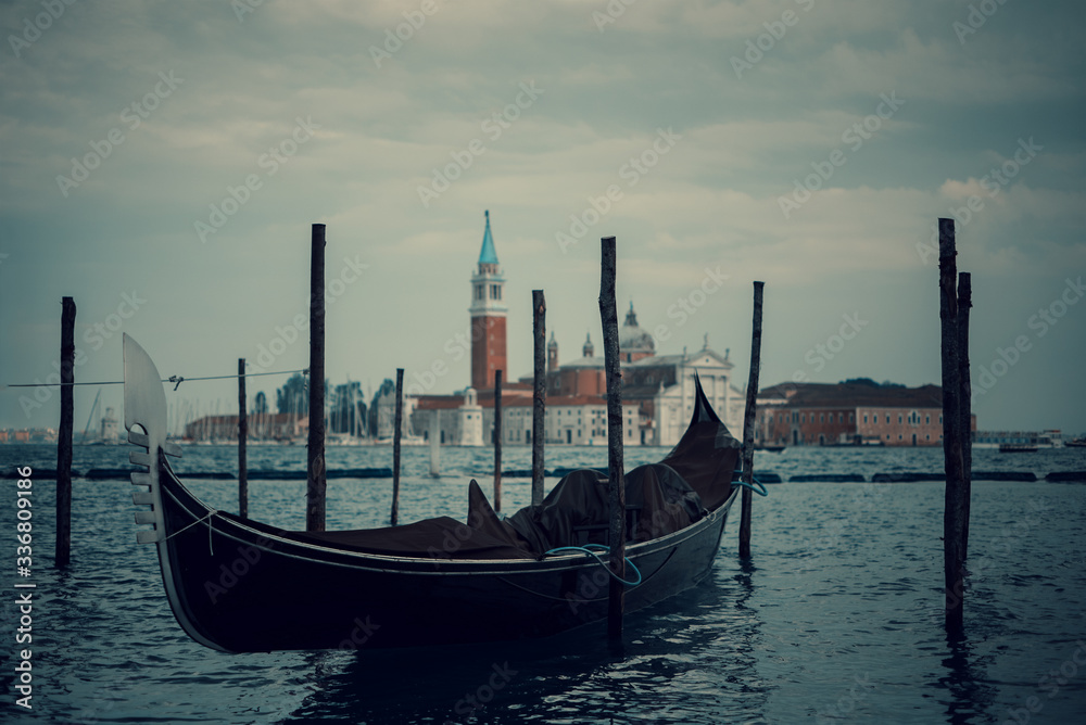 Covered abandoned gondola in Venice