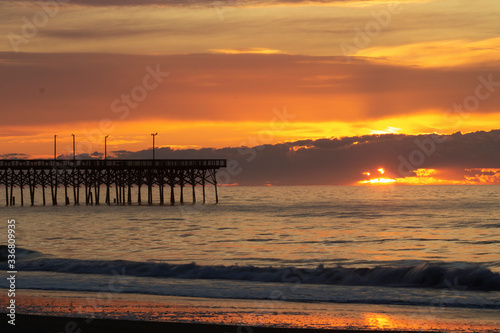 Pier with a Cloudy Sunrise