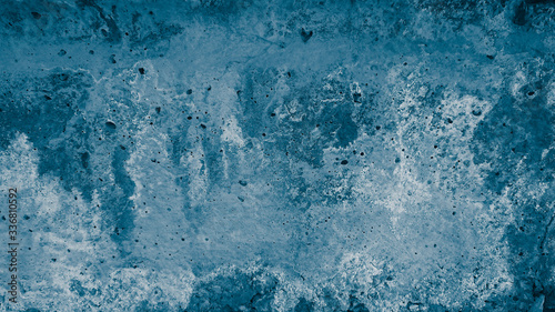 Abstract concrete background tinted in a classic blue shade.