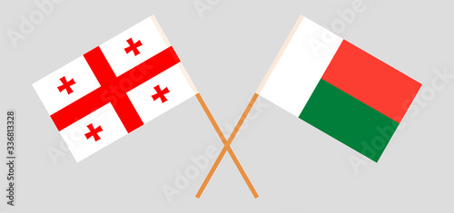 Crossed flags of Madagascar and Georgia