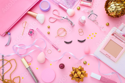 Set of professional decorative cosmetics, makeup tools and accessory on pink background. Beauty, fashion and shopping concept. Flat lay composition, top view