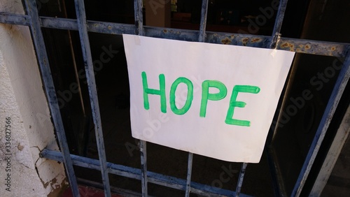 фотографія Sing saying hope on railings