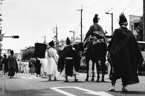 People with traditional costumes of Heian period at Aoi Matsuri parade, Kyoto, Japan (in black and white) 