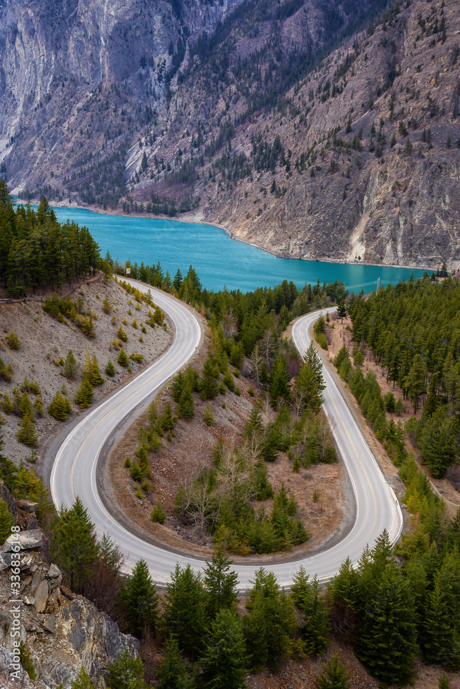 Aerial View of a Scenic Road in the Canadian Mountain Landscape during a cloudy springtime. Taken between Pemberton and Lillooet, BC, Canada.