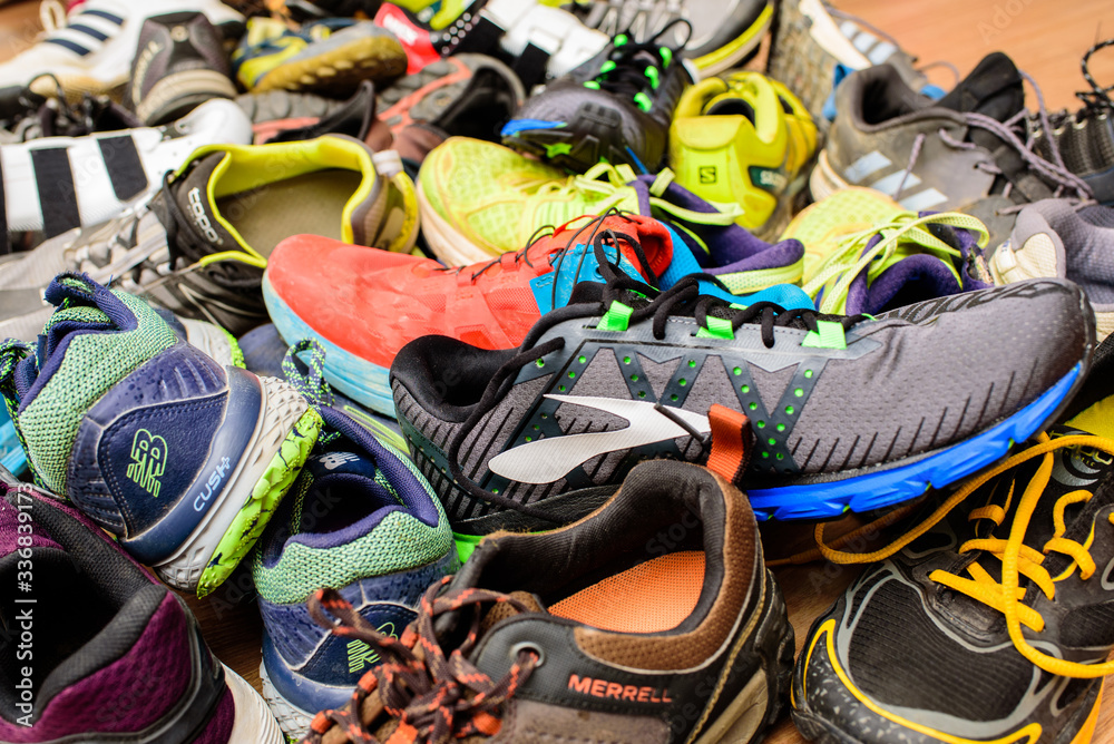 Valencia, Spain - April 7, 2020: Pile of used running sports shoes from  various brands. Stock Photo | Adobe Stock
