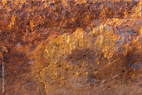 Heavily rusted and corroded metal sheet in an industrial area, suitable as a background, pattern and backdrop 