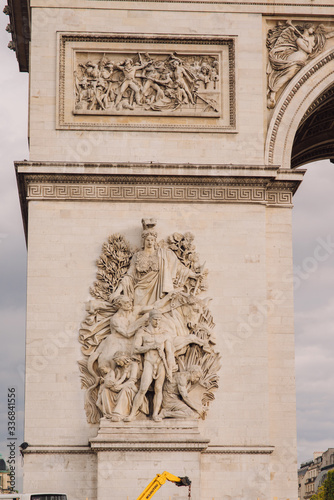 Architectural fragment of Arc de Triomphe. Arc de Triomphe de l'Etoile on Charles de Gaulle Place is one of the most famous monuments in Paris.